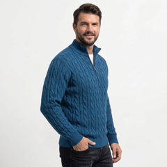 Teal blue cable knit quarter-zip sweater on model, side view