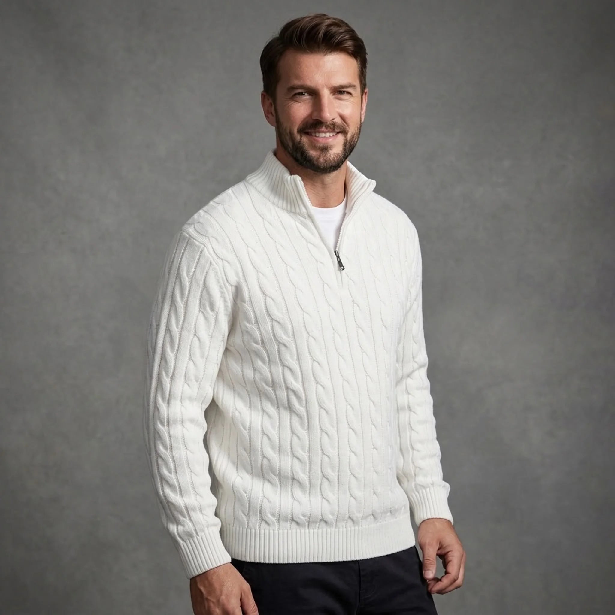White cable knit quarter-zip sweater worn with dark trousers, front view