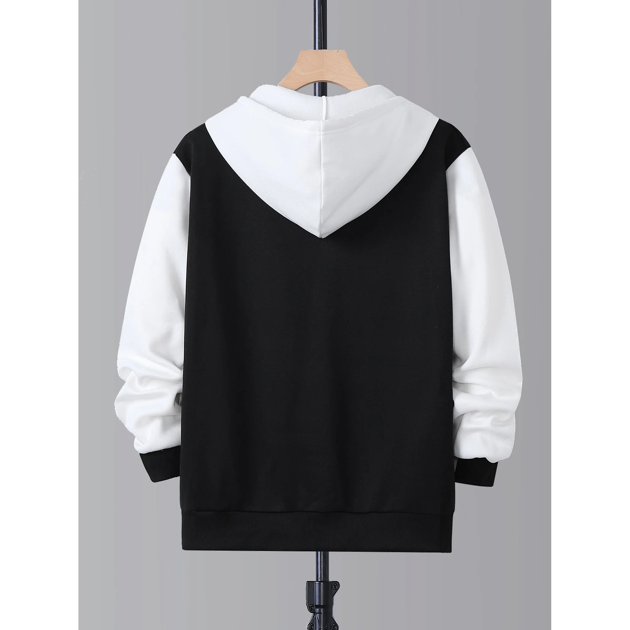 Black and white zip-up hoodie, back view on hanger