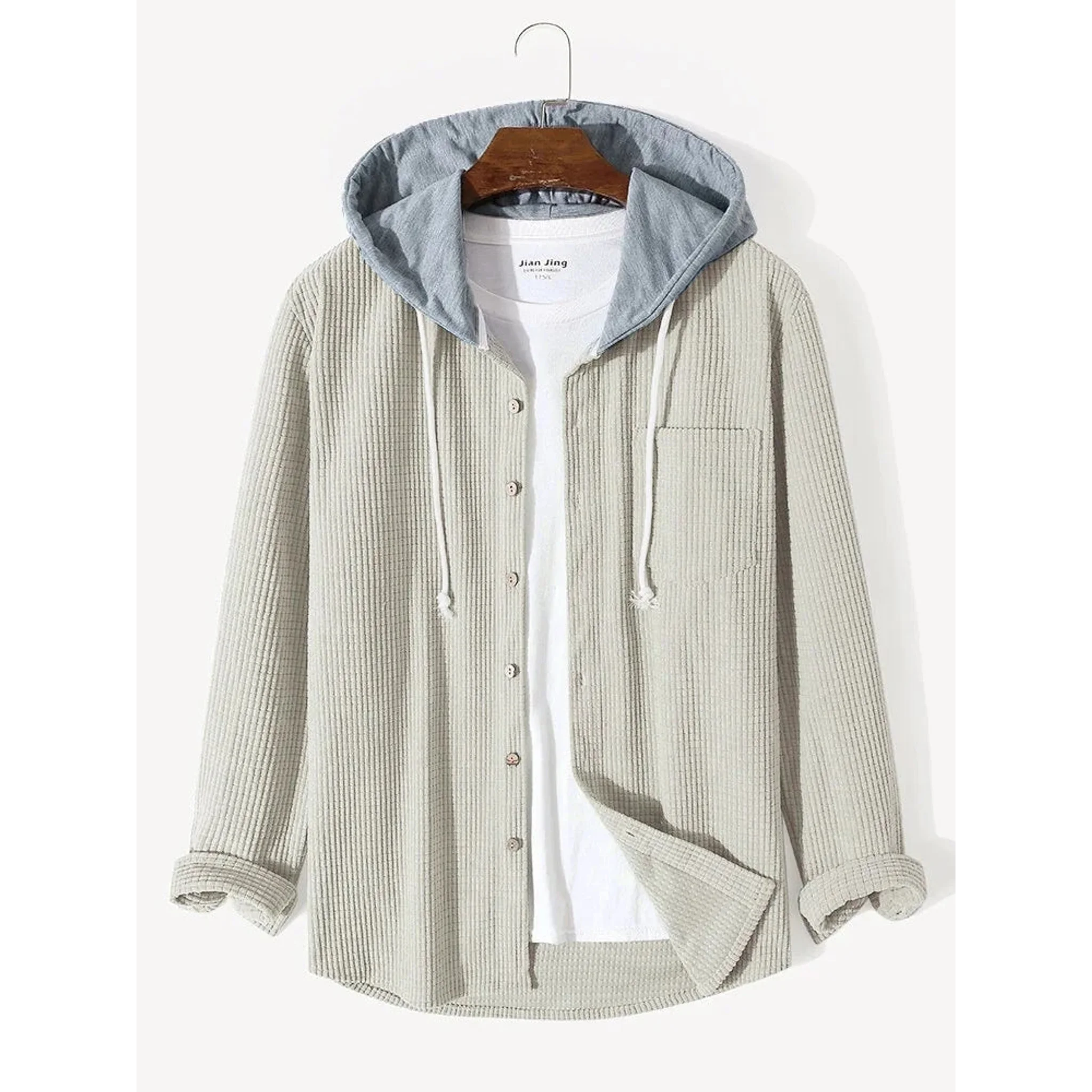 Beige corduroy hooded overshirt on a hanger, front