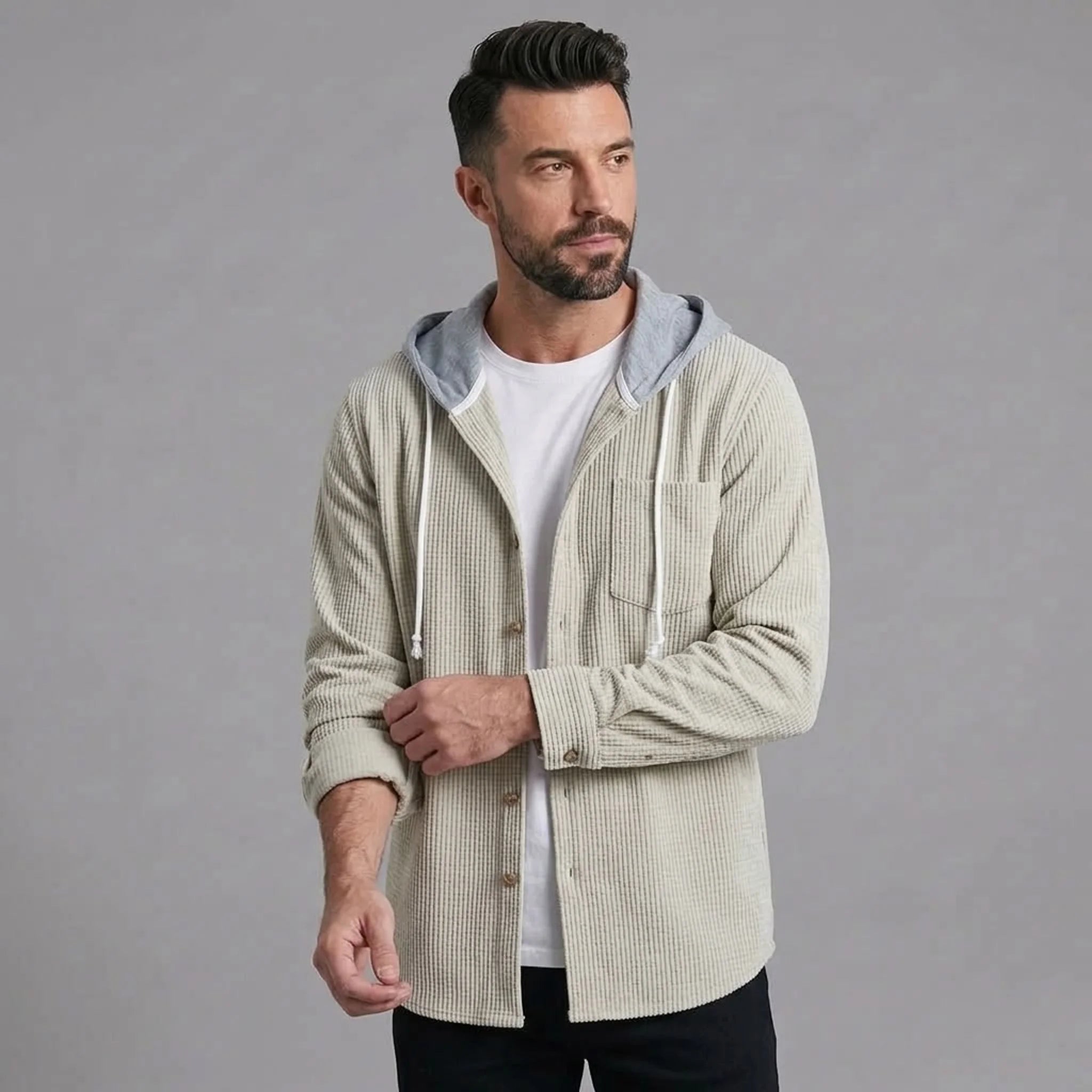 Beige corduroy hooded shirt jacket worn open over a white tee