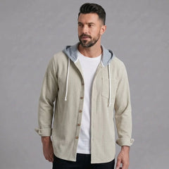 Man wearing beige corduroy hooded shirt jacket, front view