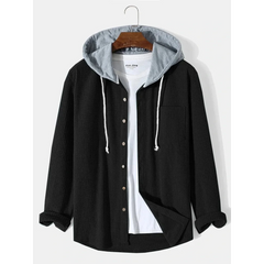 Black corduroy hooded overshirt on a hanger, front