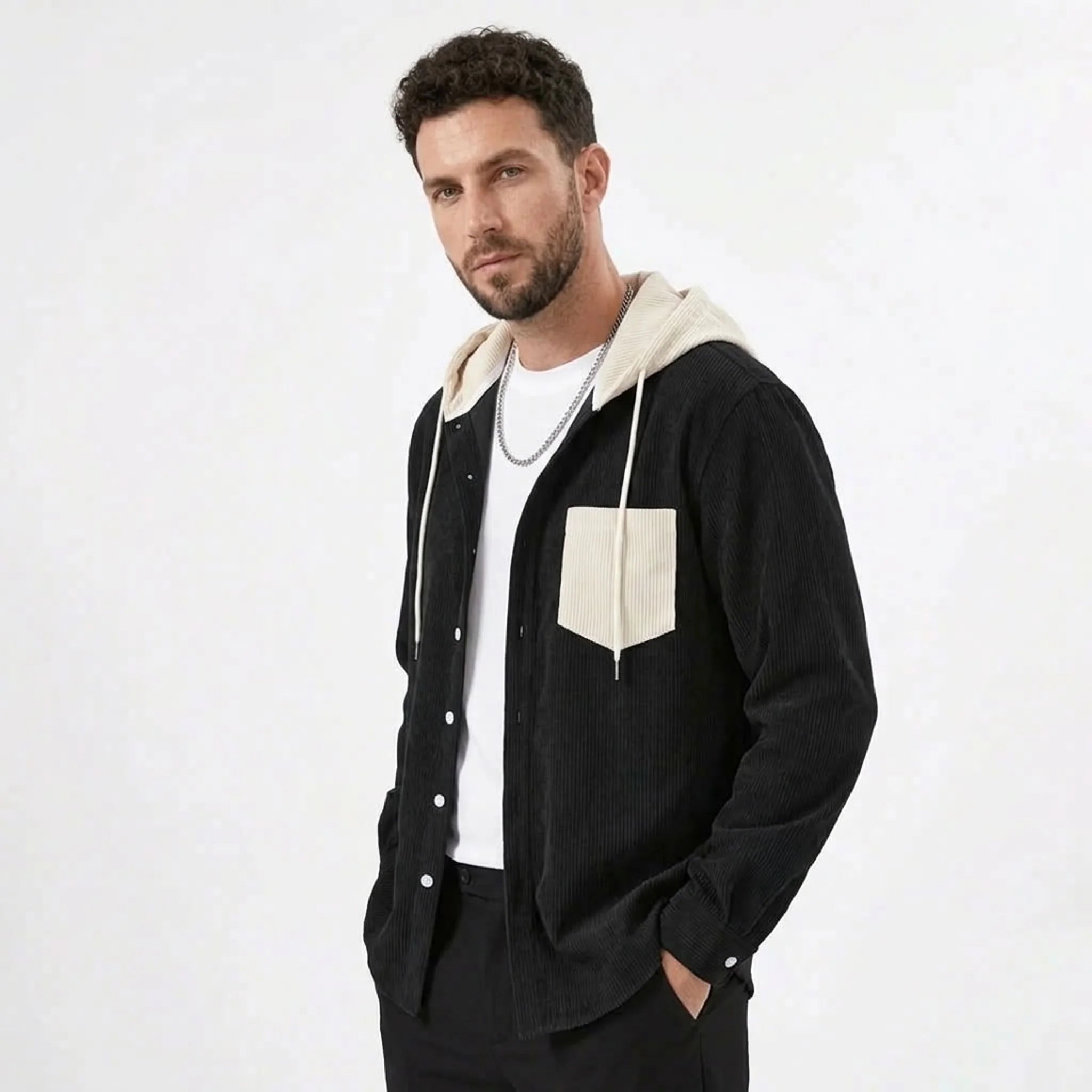 Black corduroy hooded shirt jacket, model side view
