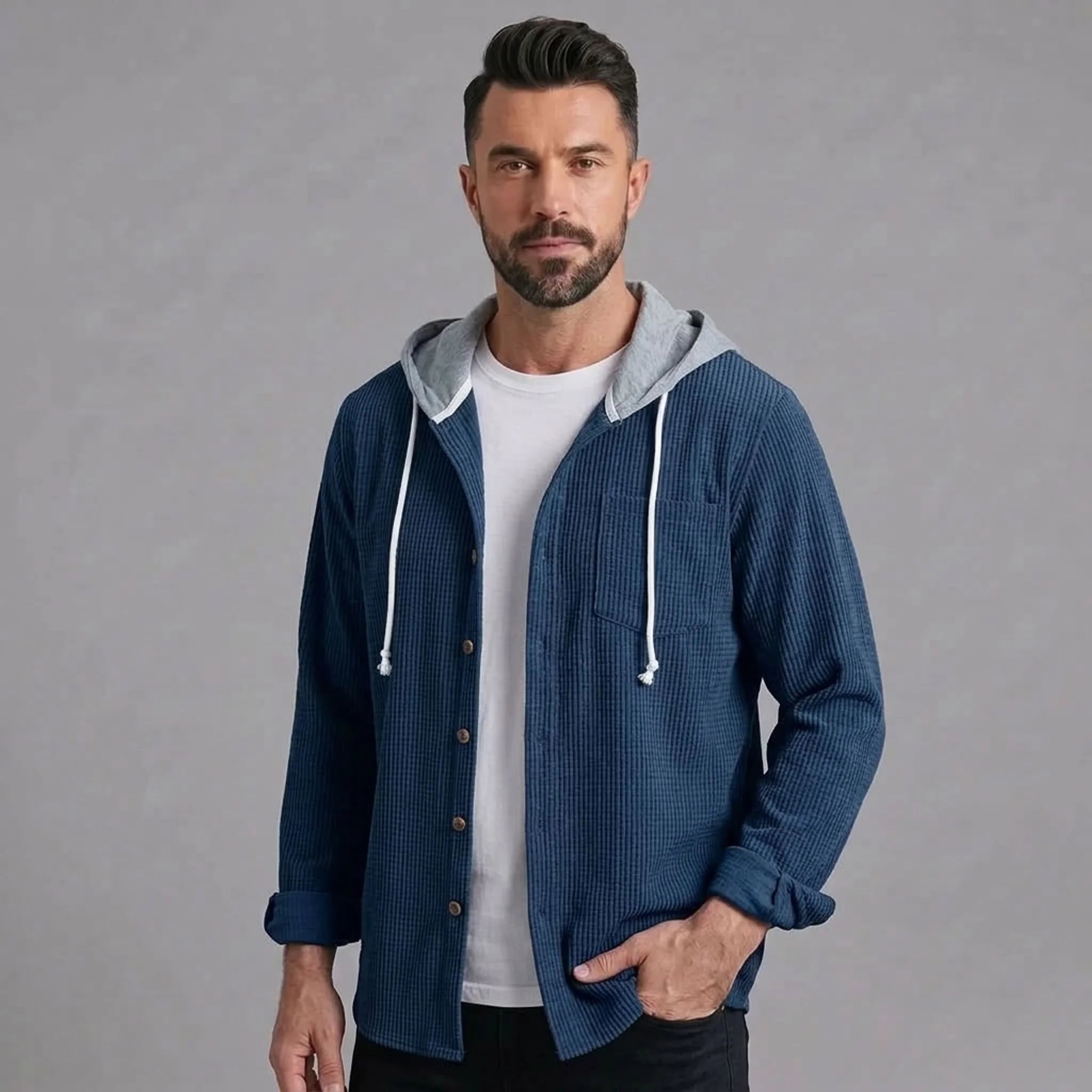 Blue corduroy hooded shirt jacket worn open over a white tee
