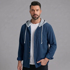 Blue corduroy hooded shirt jacket worn open over a white tee