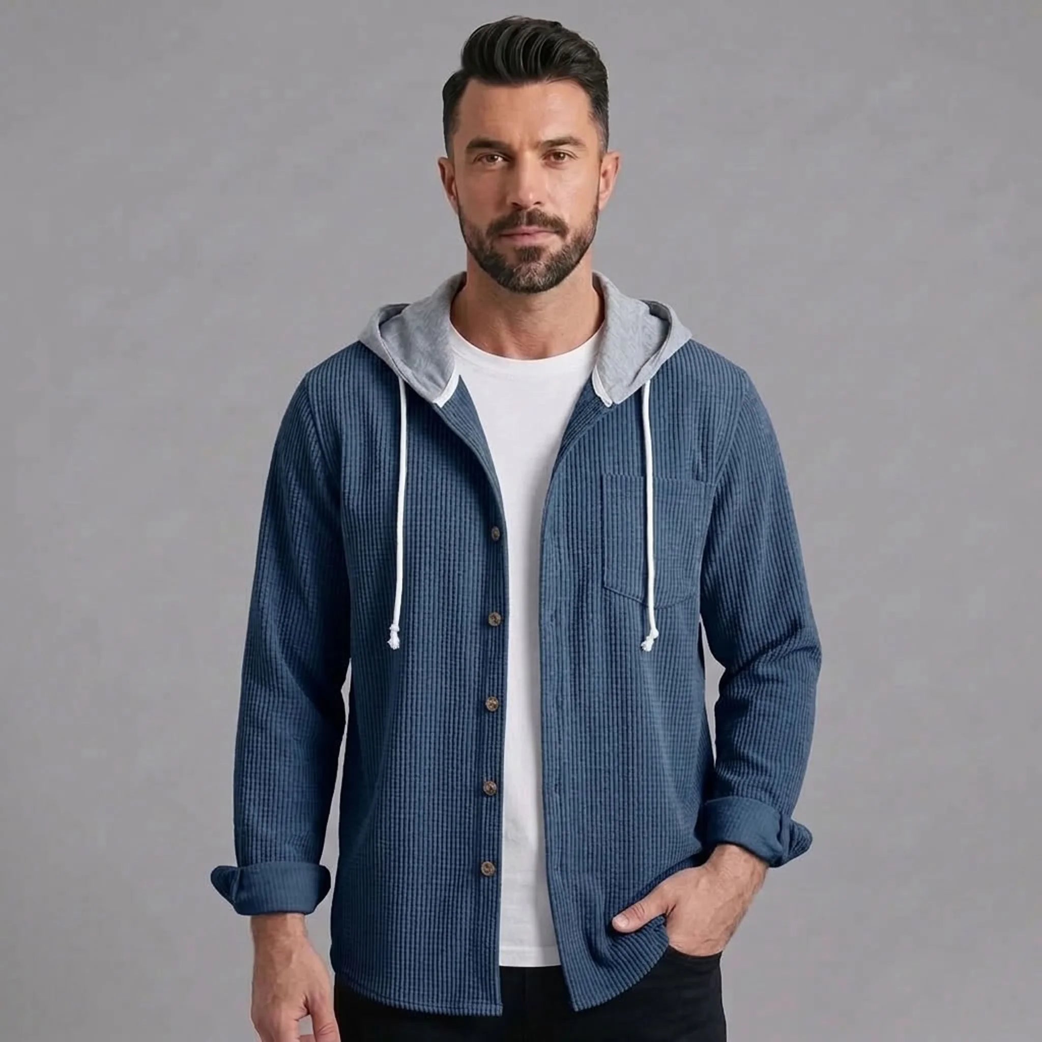 Man wearing blue corduroy hooded shirt jacket, front view