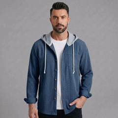 Man wearing blue corduroy hooded shirt jacket, front view