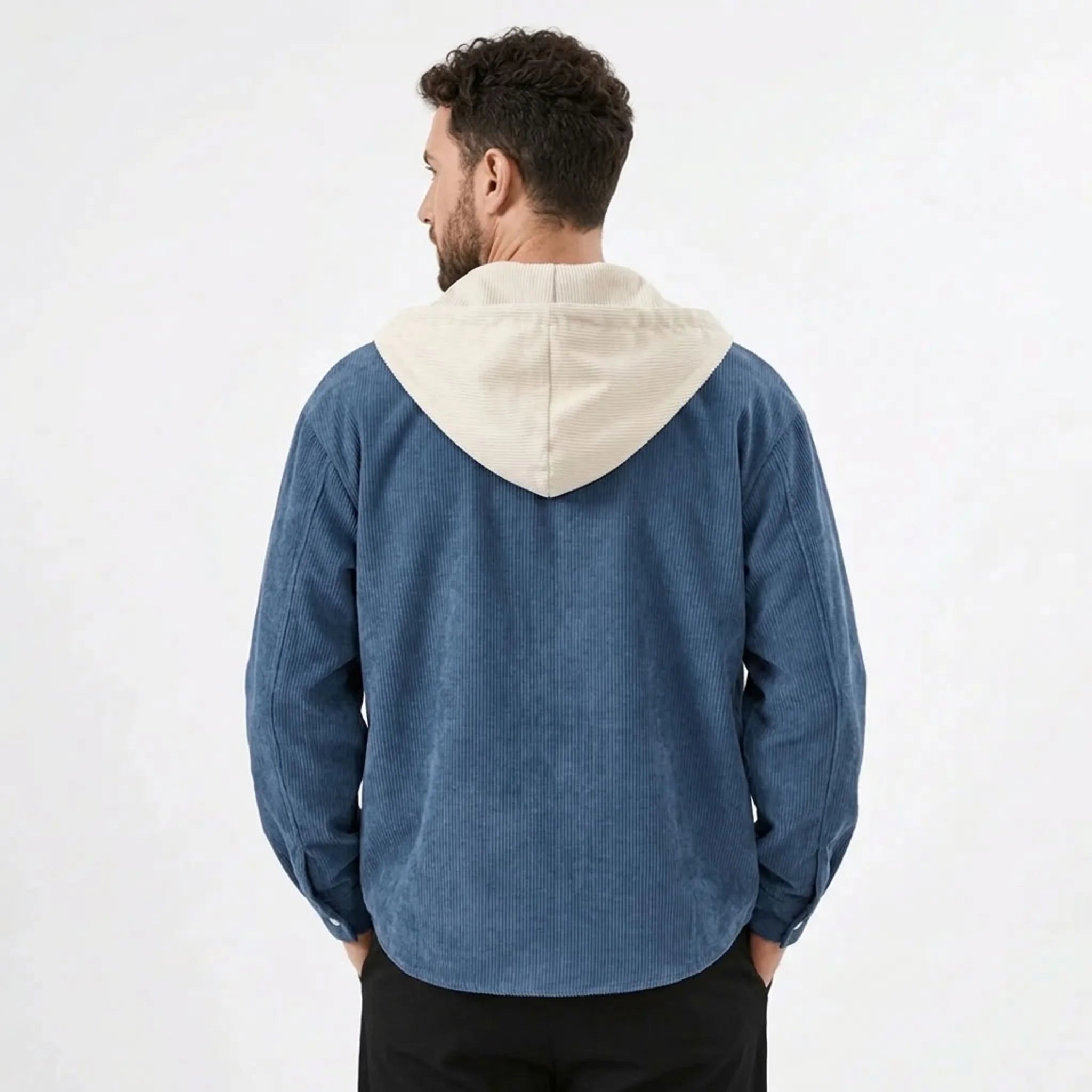 Denim blue corduroy hooded shirt jacket with cream hood, model back view
