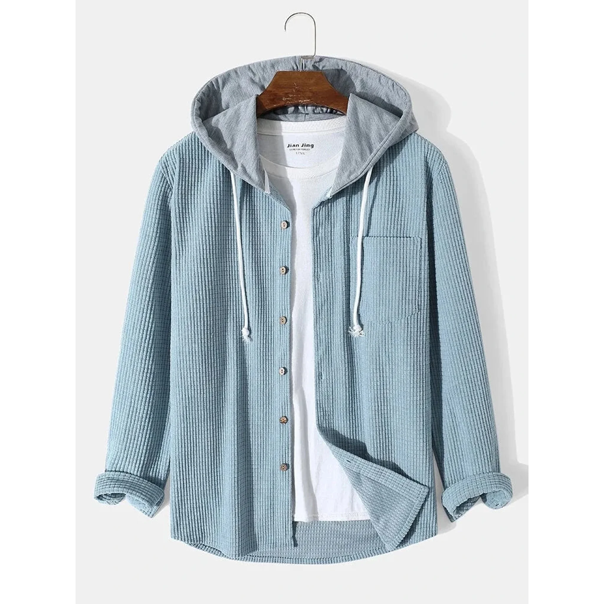 Light blue corduroy hooded overshirt on a hanger, front