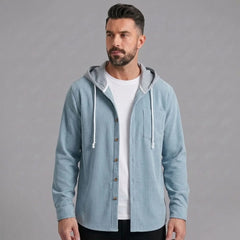 Light blue corduroy hooded shirt jacket worn open over a white tee