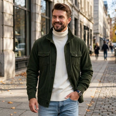 Army green corduroy jacket worn on a city street in autumn