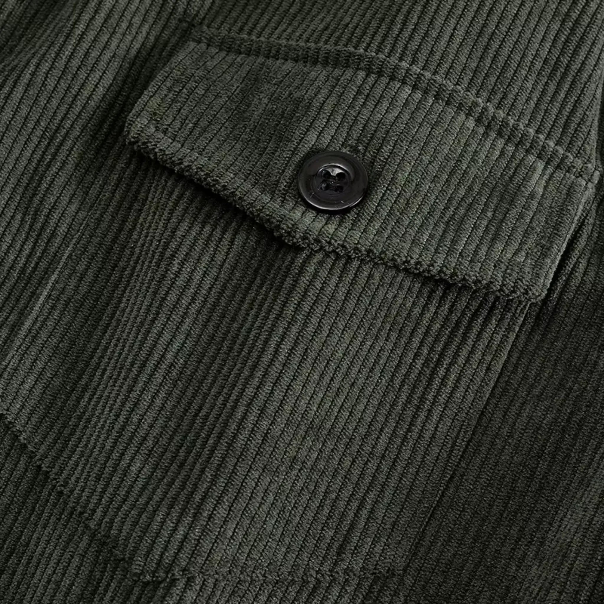 Army green corduroy jacket close-up of buttoned chest flap pocket
