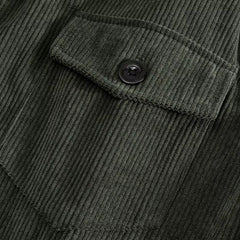 Army green corduroy jacket close-up of buttoned chest flap pocket