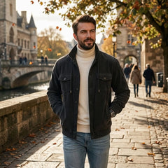 Black corduroy jacket worn on an autumn riverside promenade