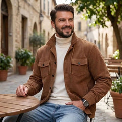 Dark brown corduroy jacket worn seated at a sunny outdoor café