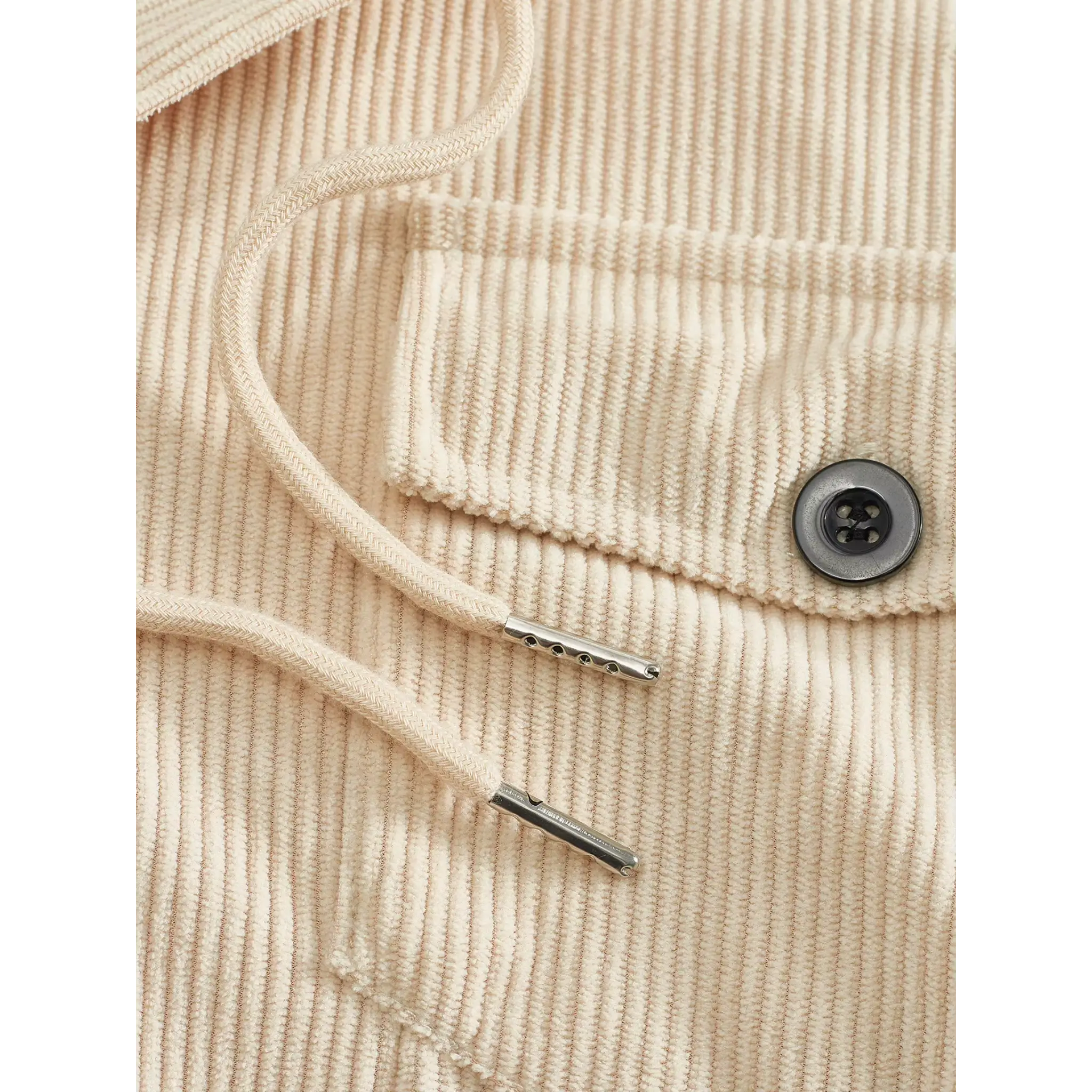 Khaki corduroy jacket close-up of collar drawstring, button and ribbed fabric