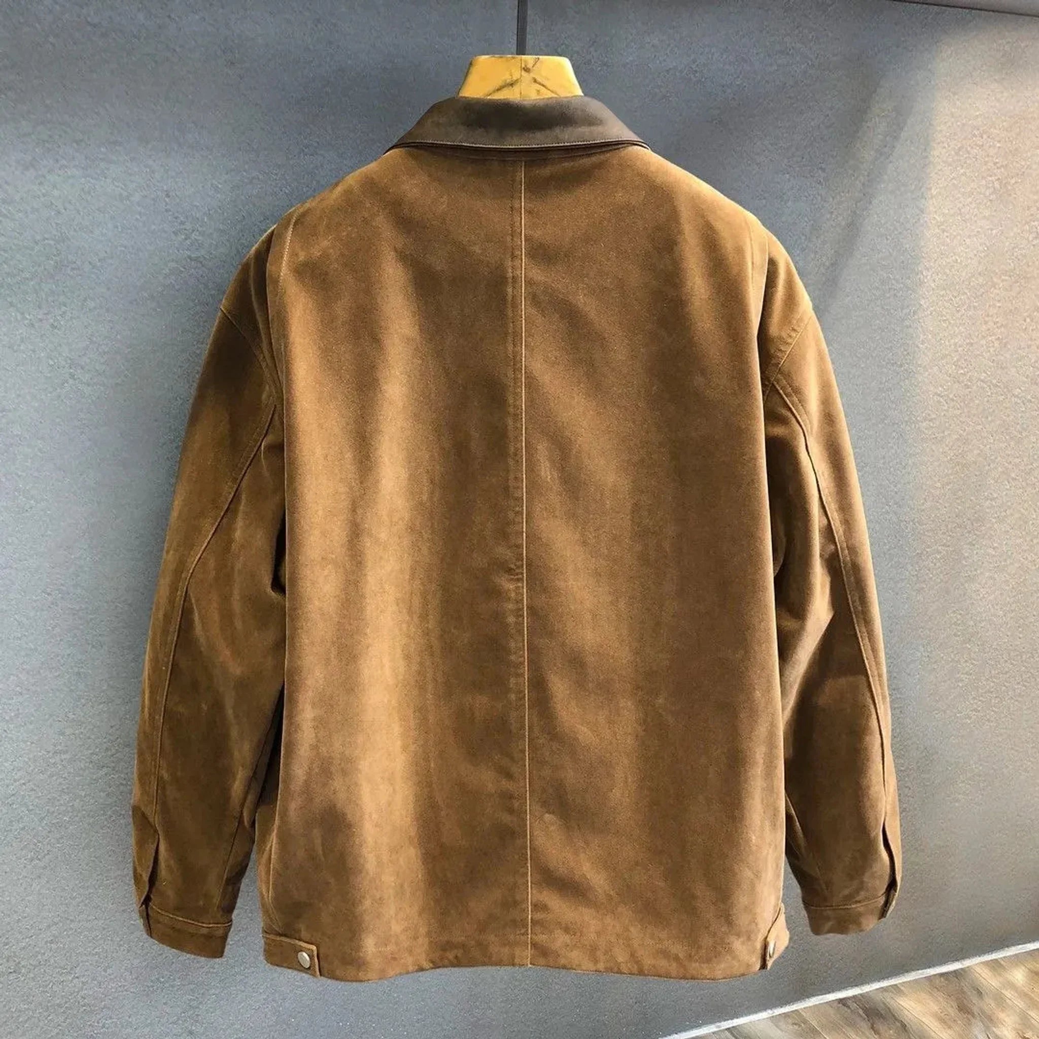 Camel faux suede zip jacket, back view on hanger