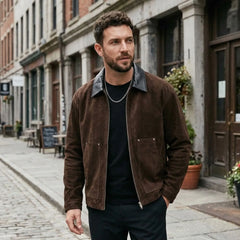 Man wearing dark brown faux suede zip jacket on a city street