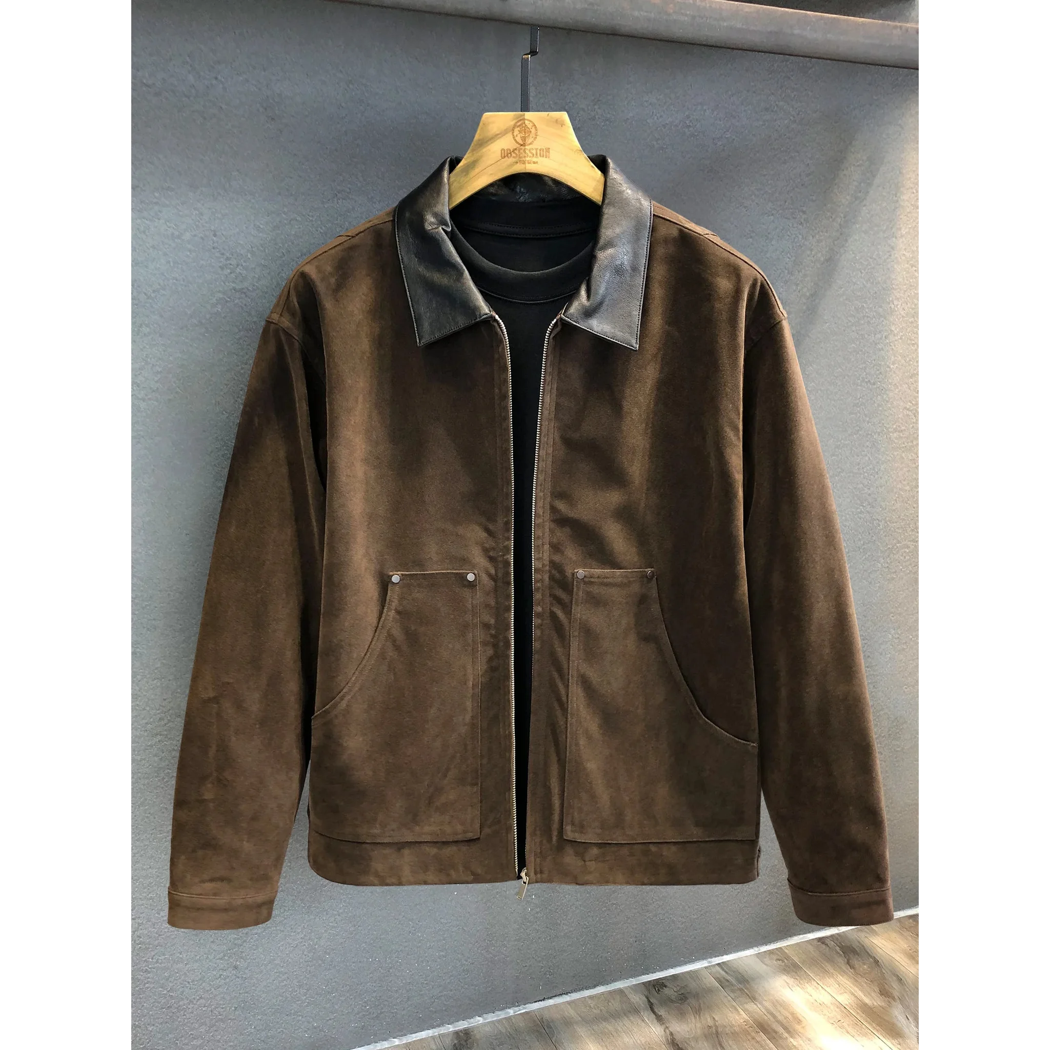 Dark brown faux suede zip jacket, front view on hanger