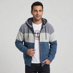 Man wearing denim blue color-block fleece-lined knit zip hoodie, front view