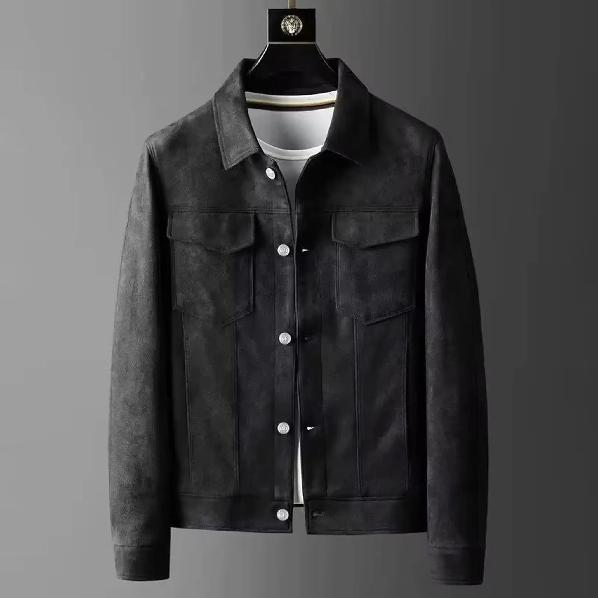 Black suede-look trucker jacket on a hanger, front view with chest flap pockets and buttons