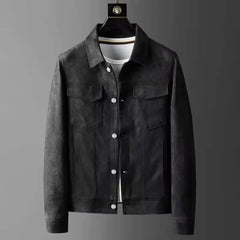 Black suede-look trucker jacket on a hanger, front view with chest flap pockets and buttons