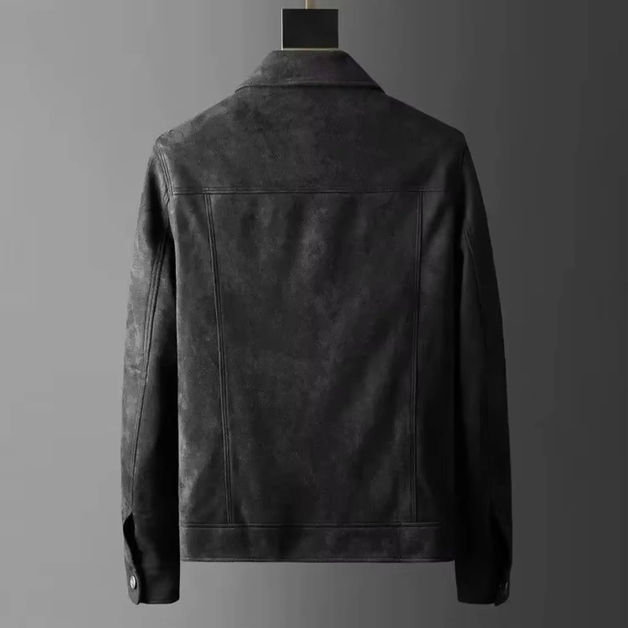Black suede-look trucker jacket on a hanger, back view