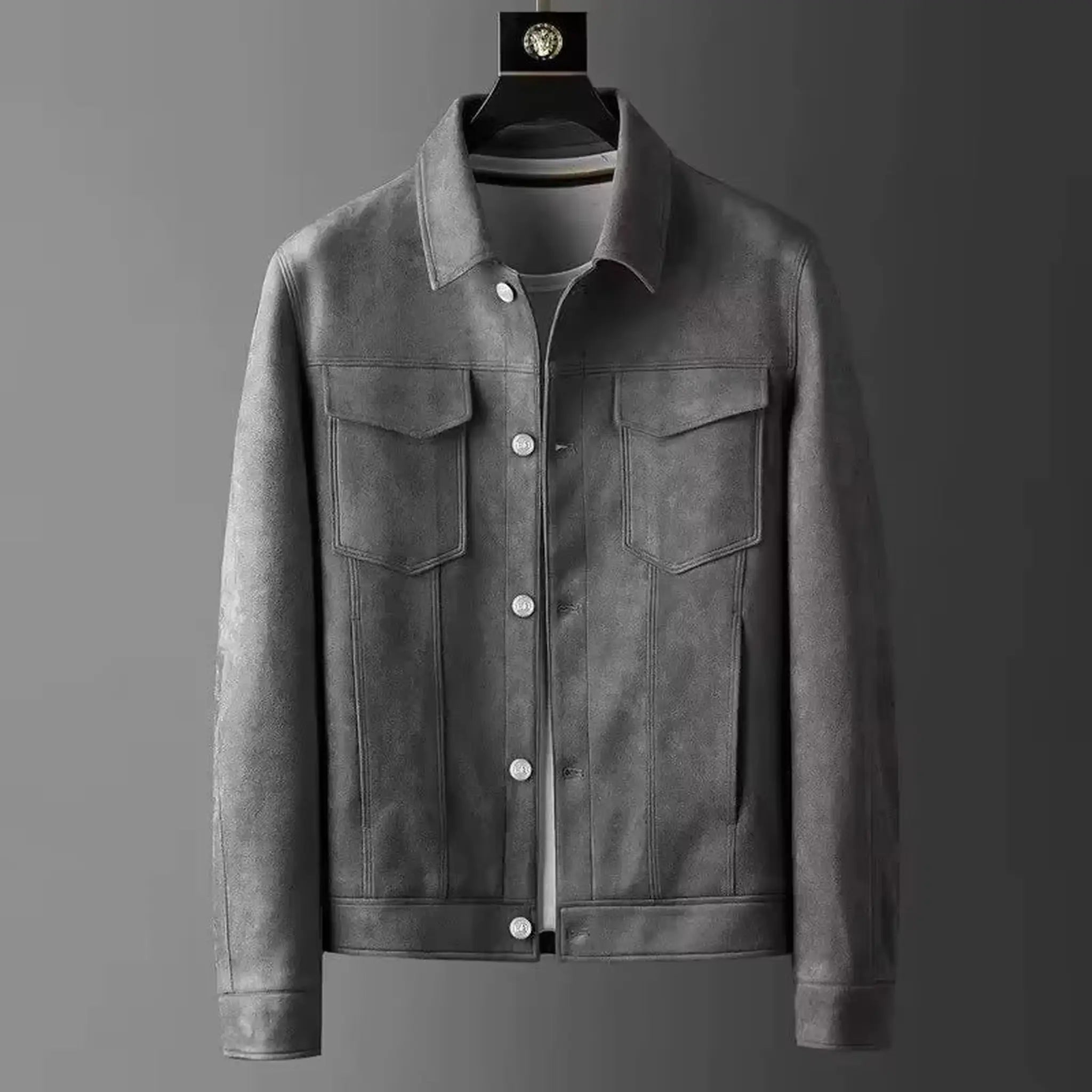 Gray suede-look trucker jacket on a hanger, front view with chest flap pockets and buttons