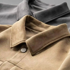 Close-up of the pointed collar and top button of a khaki suede-look trucker jacket