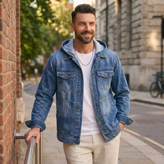 Man in light blue hooded denim jacket and white tee on a city street