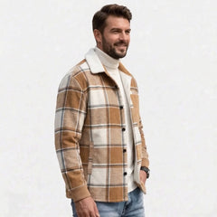 Man wearing khaki plaid shirt jacket, three-quarter view