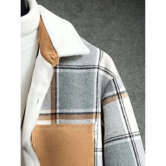 Corduroy collar and chest pocket detail on light grey plaid shirt jacket
