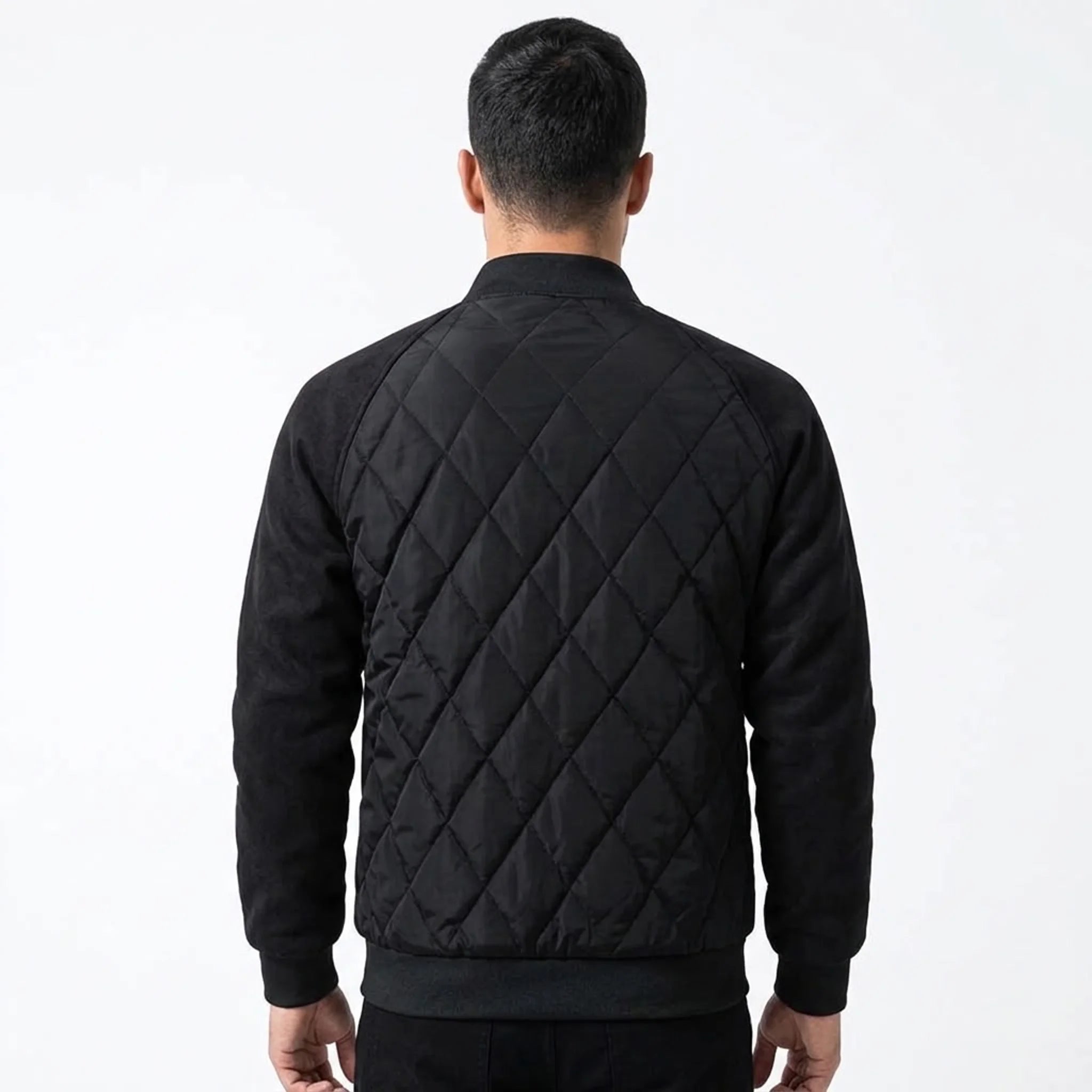 Black quilted bomber jacket on model, back view
