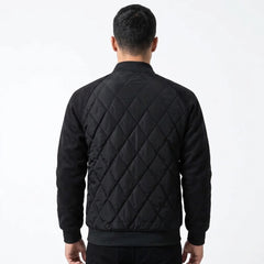 Black quilted bomber jacket on model, back view