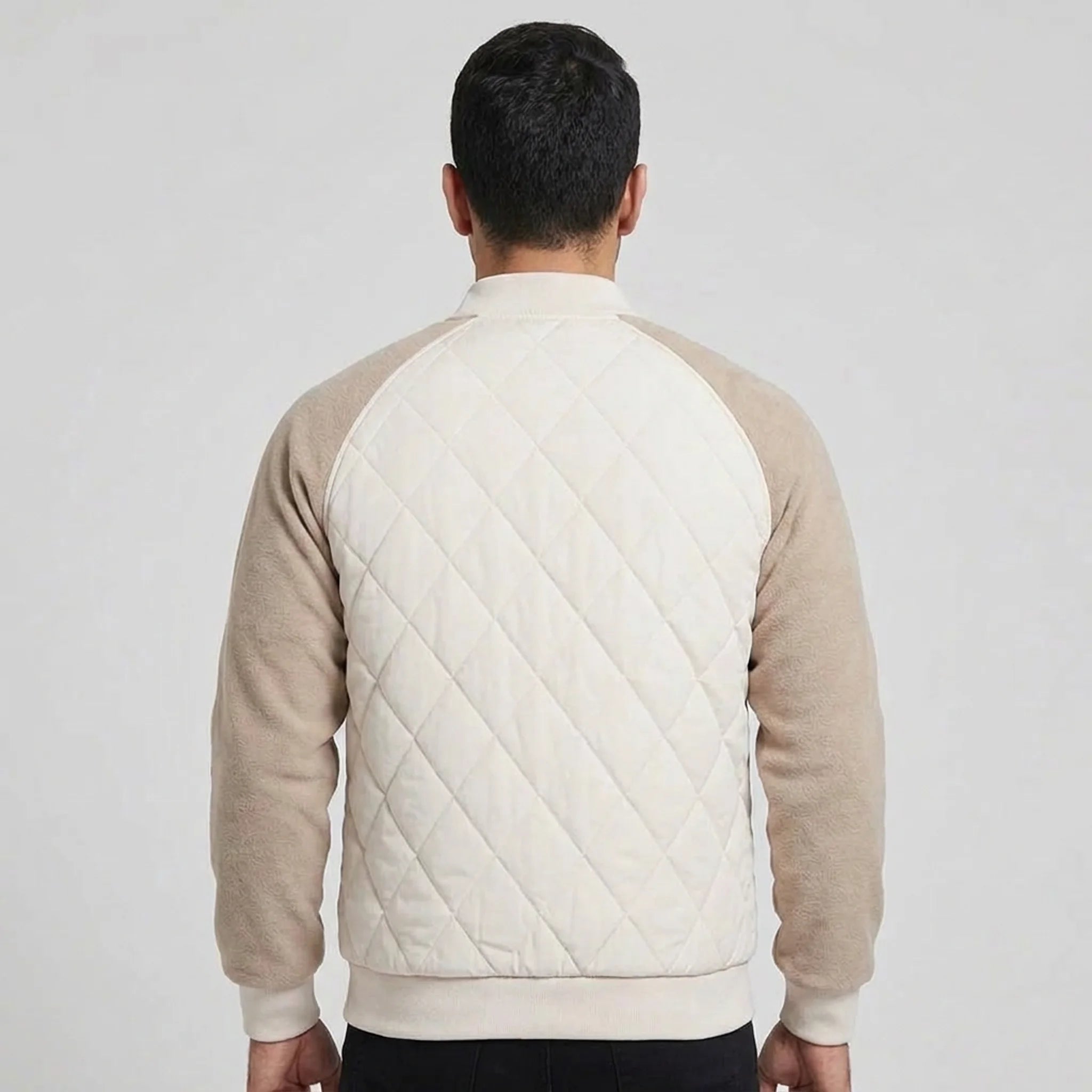 Cream quilted bomber jacket on model, back view