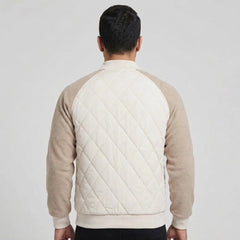 Cream quilted bomber jacket on model, back view