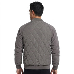 Grey quilted bomber jacket on model, back view