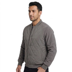 Grey quilted bomber jacket on model, side view