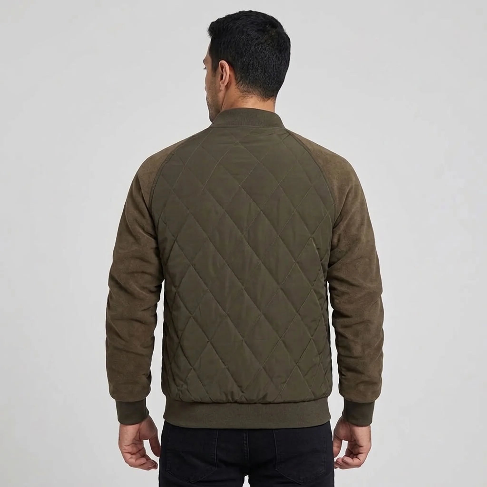Olive quilted bomber jacket on model, back view
