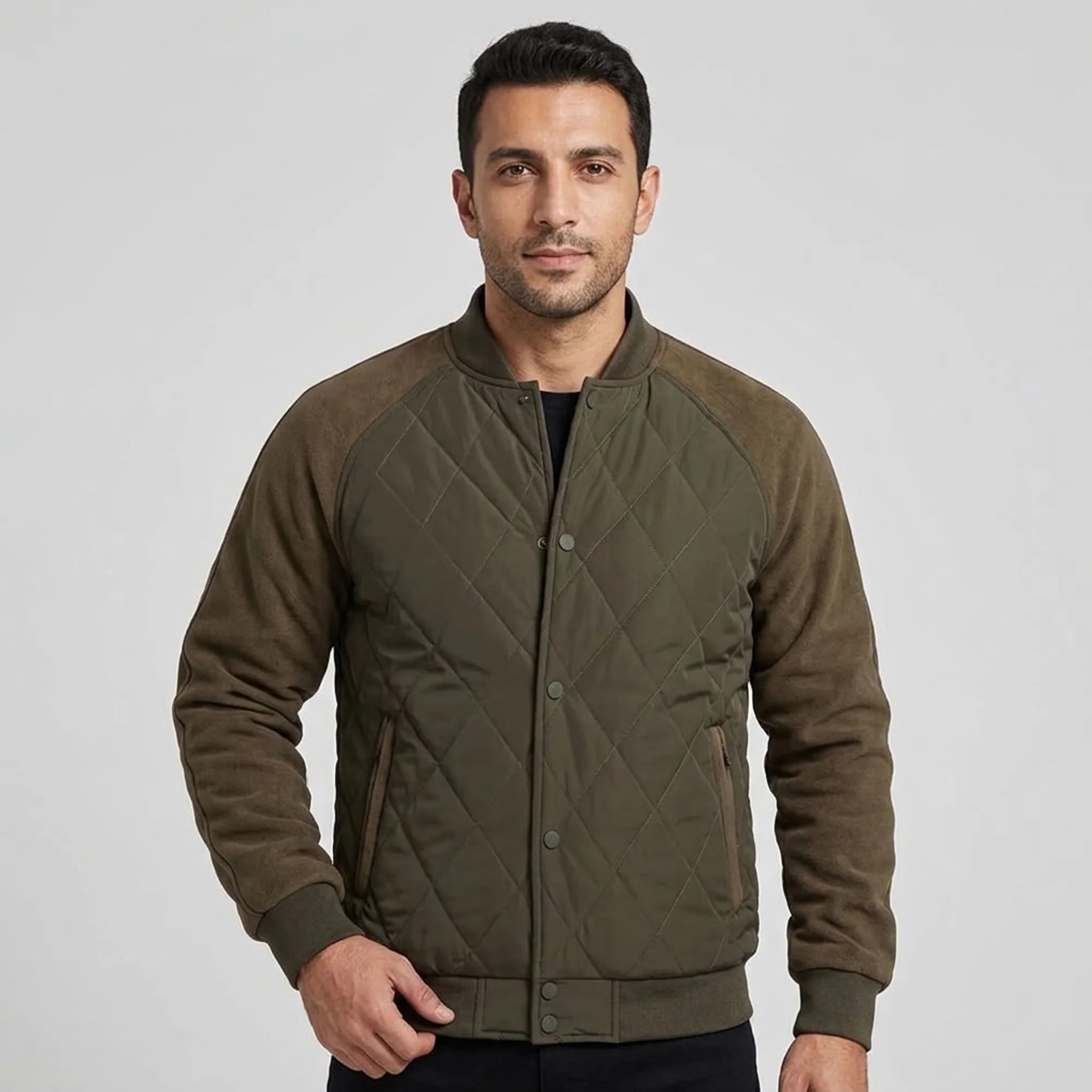 MannerCo men's olive quilted bomber jacket with baseball collar, front view on model