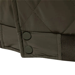 Quilted bomber jacket snap buttons and ribbed hem, close-up
