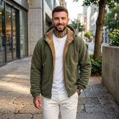 Man wearing army green sherpa fleece hooded jacket on a city street