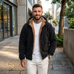 Man wearing black sherpa fleece hooded jacket on a city street