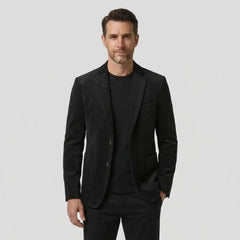 Men's black slim fit single-breasted blazer, front view on model