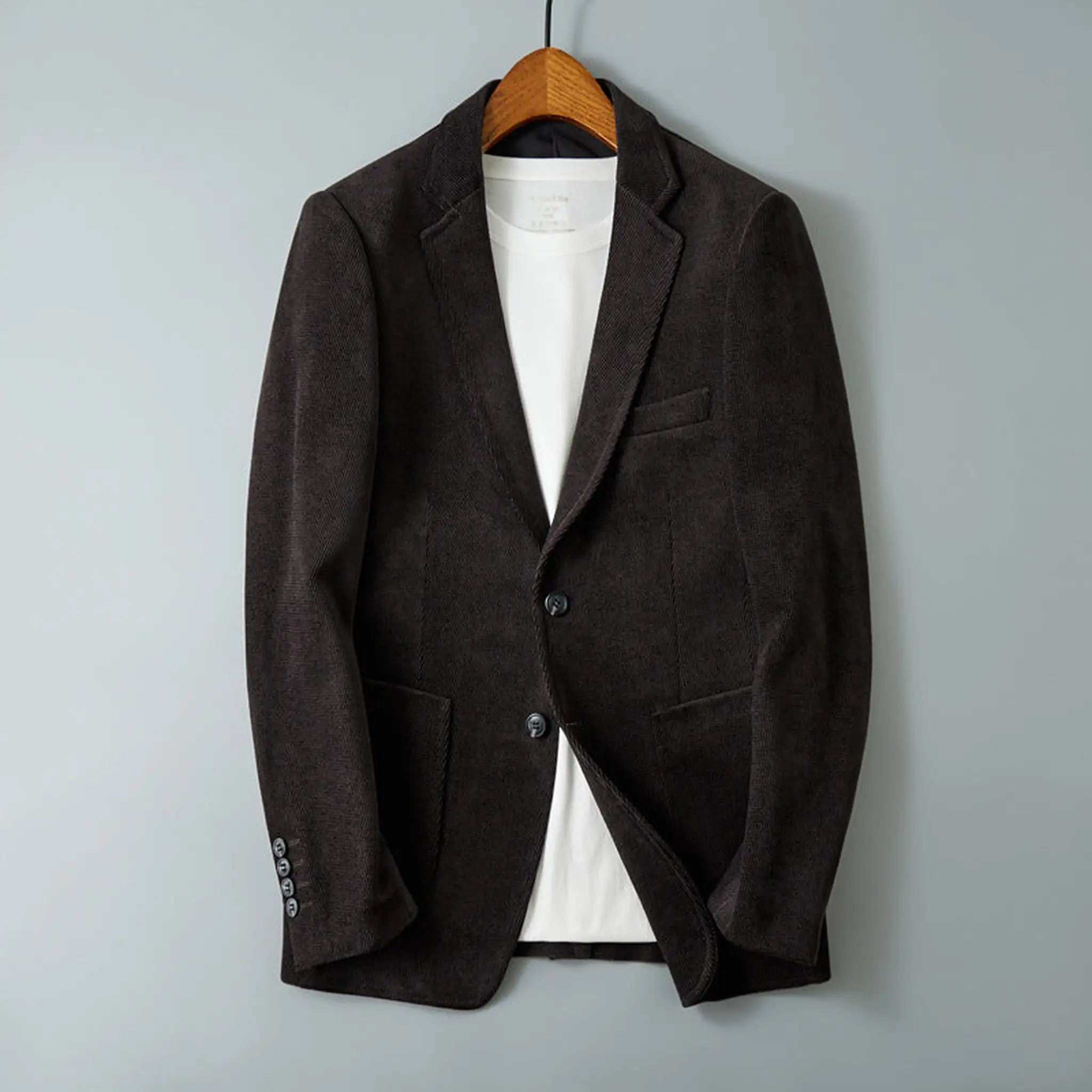 Dark purple blazer on a hanger, front view