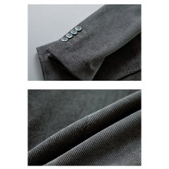 Gray blazer sleeve buttons and fabric close-up
