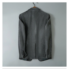 Gray blazer on a hanger, back view