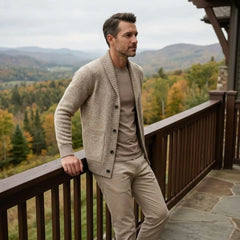 MannerCo men's khaki slim fit cardigan sweater with lapel collar worn outdoors on mountain deck