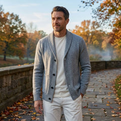 MannerCo men's light gray shawl lapel cardigan sweater worn over white tee in autumn park